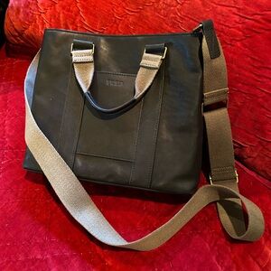 Elegant Black Crossbody Bag with Tan Strap